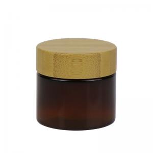 China Empty Cosmetic PET Cream Jar 50g 100g Plastic Container With Wooden Lid wholesale