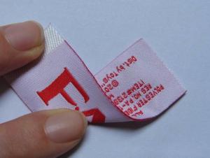 China No Shrinking PMS Garment Woven Iron Labels With Heat Cut Border wholesale