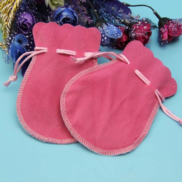 small velvet drawstring gift bag with satin lining inside with gold logo stamped