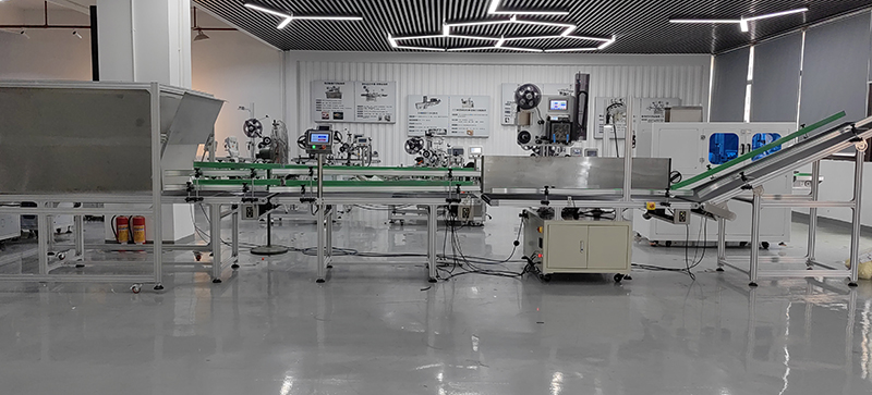 Beverage Labeling Systems with Real Time Printing and Top Side Application Features