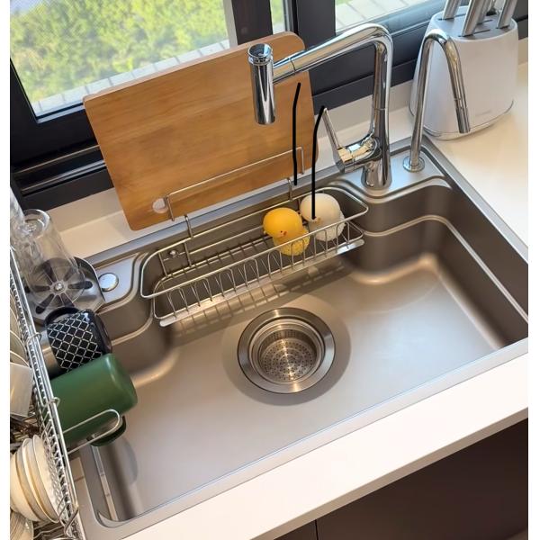 Customer using kitchen sink in modern kitchen setting