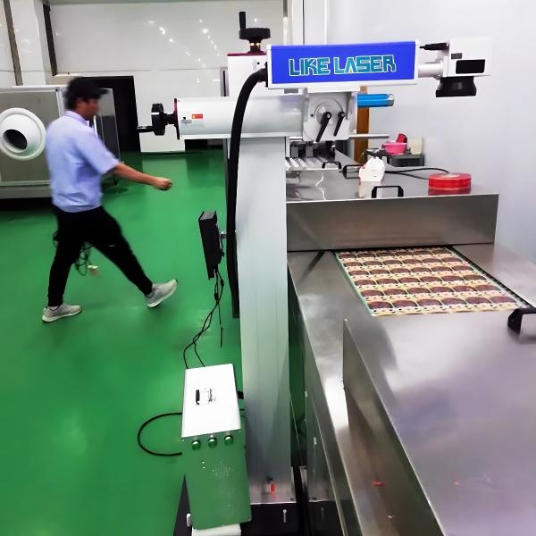 Quality Mask Pattern Marking 50W Customized Conveyor Flying Fiber Laser Logo Printing Machine for sale