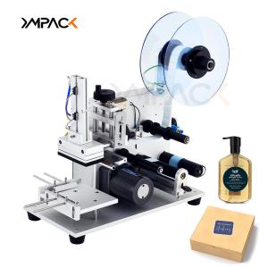 China YM120 Manual Flat Labeling Machine For Cardboard Boxes / Square Bottles / Tin Cans wholesale