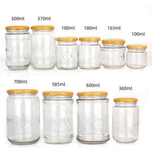 China 100ml 300ml 700ml Clear Honey Jam Food Glass Jar Bottles With Metal Lid on sale